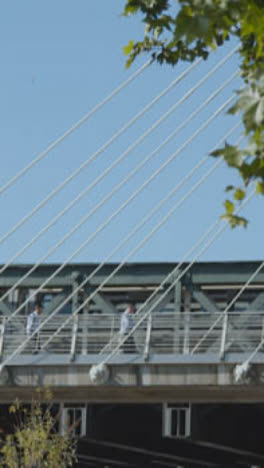 Vertical-Video-Commuters-Hungerford-Charing-Cross-Bridge-In-London